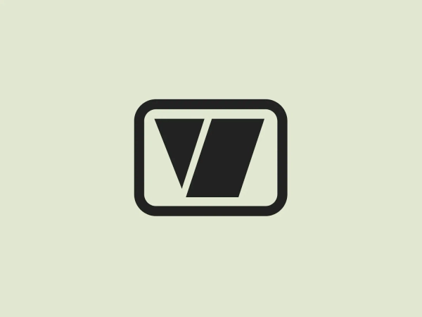 The image shows a stylized, modern logo consisting of a dark blue, geometric design. It features an abstract shape resembling a letter V or a checkmark within a rounded rectangle. The Vanguard Storage logo has a clean, sharp look with the positive space of the letter V contrasting against the negative space inside the rectangle. This creates an illusion of depth and perspective within a flat design. The simplicity of the design and the use of a single color give it a versatile and professional appearance.