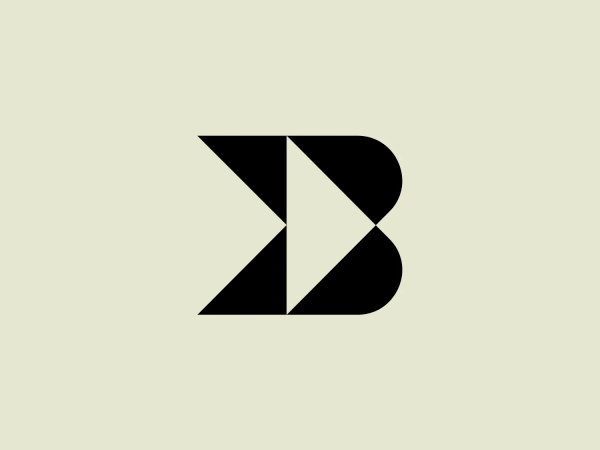 The image depicts the Backforce logo, a stylized design composed of angular segments forming a bold letter B. It features a high-contrast black and white color scheme, with one half of the B colored black and the other half white, creating a striking visual effect. The design is modern, minimalist, and plays with negative space and geometric shapes. The sharp angles and color division give an illusion of depth and dimension, while maintaining a clean and strong visual identity. The overall concept conveys a sense of dynamism and precision.