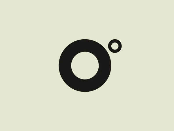 The ZeroDegrees Inc logo showcases a strong, black circle connected to a smaller circle on its right by a thin line, set against a white background. This minimalist design evokes a contemporary, polished feel that can symbolize unity, orbit, or a focal point. The stark shapes without extra adornments highlight clarity and simplicity.