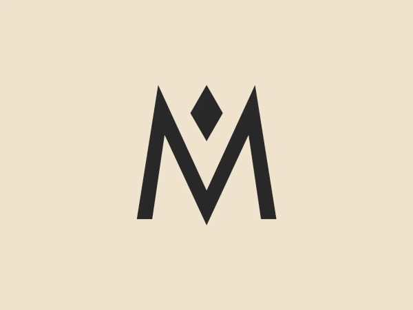 The Historisches Museum Frankfurt logo features a bold and bright red, stylized, geometric representation of the letter "M". The design incorporates sharp angular shapes, two ascending diagonal lines, a horizontal line, and a diamond shape crowning the center. The aesthetic is modern and minimalistic, with a solid, monochromatic color scheme, emphasizing simplicity and strength, while communicating a sense of stability and balance through its symmetrical form.