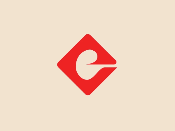 The image is a logo for Ege Seramik featuring a bright red square diamond shape set on one of its corners, with a white, stylized letter 'e' in the center that doubles as a negative space. The 'e' has a fluid, swooping design that suggests motion and dynamism. The overall aesthetic is modern and minimalistic, emphasizing clean lines and a bold use of contrast between the red and white. The red color evokes energy and passion, while the simplicity of the design suggests efficiency and forward-thinking.