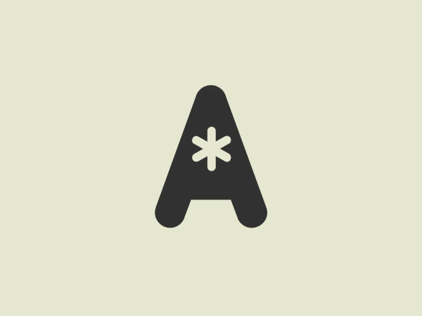 The business logo for Actionable Books is a stylized letter "A" in a bold red color with a flat design style. It is symmetric with a solid fill and features a unique asterisk or star-like shape at the center, suggesting some form of specialism or distinction. The "A" has soft, rounded corners, giving it a modern and approachable feel. Due to its simplicity and use of a single color, the logo would stand out well against a minimal and light background.
