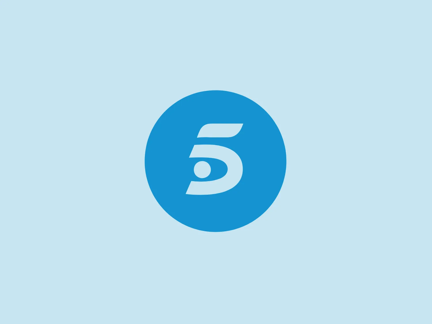 The Telecinco logo features a stylized number "5" centered within a solid circle. The design utilizes a bold, modern sans-serif font, with the "5" appearing dynamic due to a subtle curvature at the top and a sweeping tail. The use of negative space within the "5" adds an interesting visual element, creating an implied diagonal line that adds movement to the design. The logo is monochromatic with a vibrant blue tone, which suggests a sense of trustworthiness, stability, and technology. The simplicity of the design makes it easily recognizable and scalable for various applications.