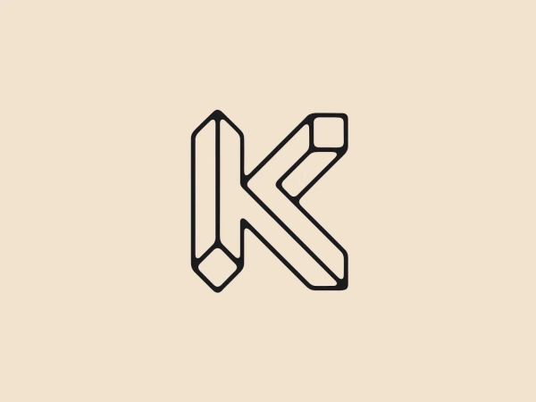 The KIOSK Budapest logo features a stylized letter "K," formed by geometric shapes that create a three-dimensional effect. Consisting of straight lines and angles, the design maintains a consistent line thickness. The elongated main body of the "K" and its asymmetric arms create a modern, clean aesthetic with sharp corners, free from embellishments. The monochromatic black and white color scheme adds a timeless and versatile quality to the logo.