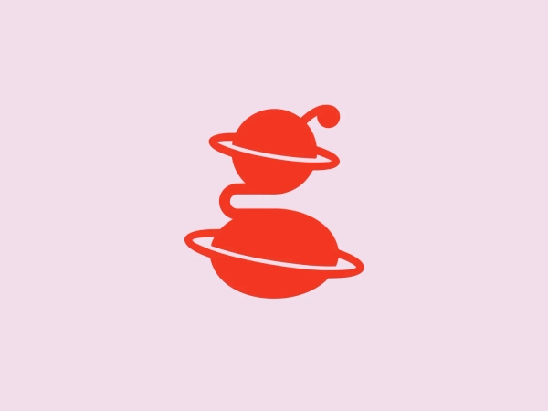 The Gravity Leadership logo is an abstract depiction of a stack of three playful and futuristic celestial bodies. The design utilizes a bright red color with white accents, emphasizing the orbiting rings. The topmost planet includes a whimsical antenna-like protrusion, adding character to the overall image. Its simplicity makes it modern and easily recognizable, while the use of circles and curved lines creates a sense of harmony and motion.