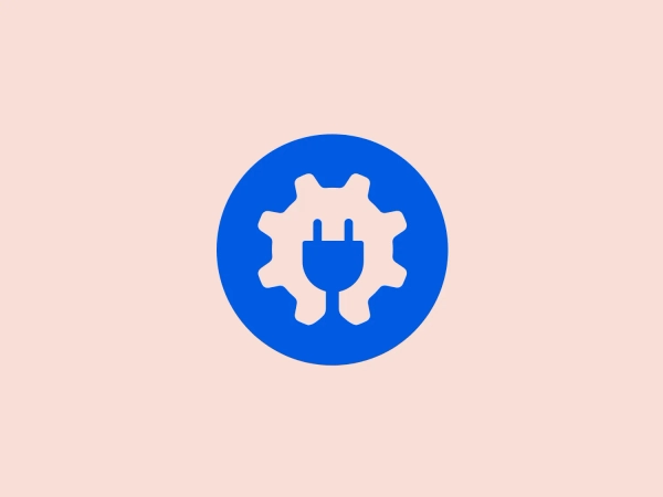 The Aioseo logo features a simple yet highly symbolic design with a central white gear or cog icon that integrates a three-pronged electrical plug silhouette within its center. Set against a bold blue circular background, the gear's teeth are evenly spaced around its perimeter, suggesting precision and interconnectivity, while the electrical plug communicates energy or technology. The overall design aesthetic is modern and clean, using contrast effectively to convey a sense of innovation and mechanization. The color scheme is minimalistic, employing only blue and white, which adds to the logo's crisp and professional look.