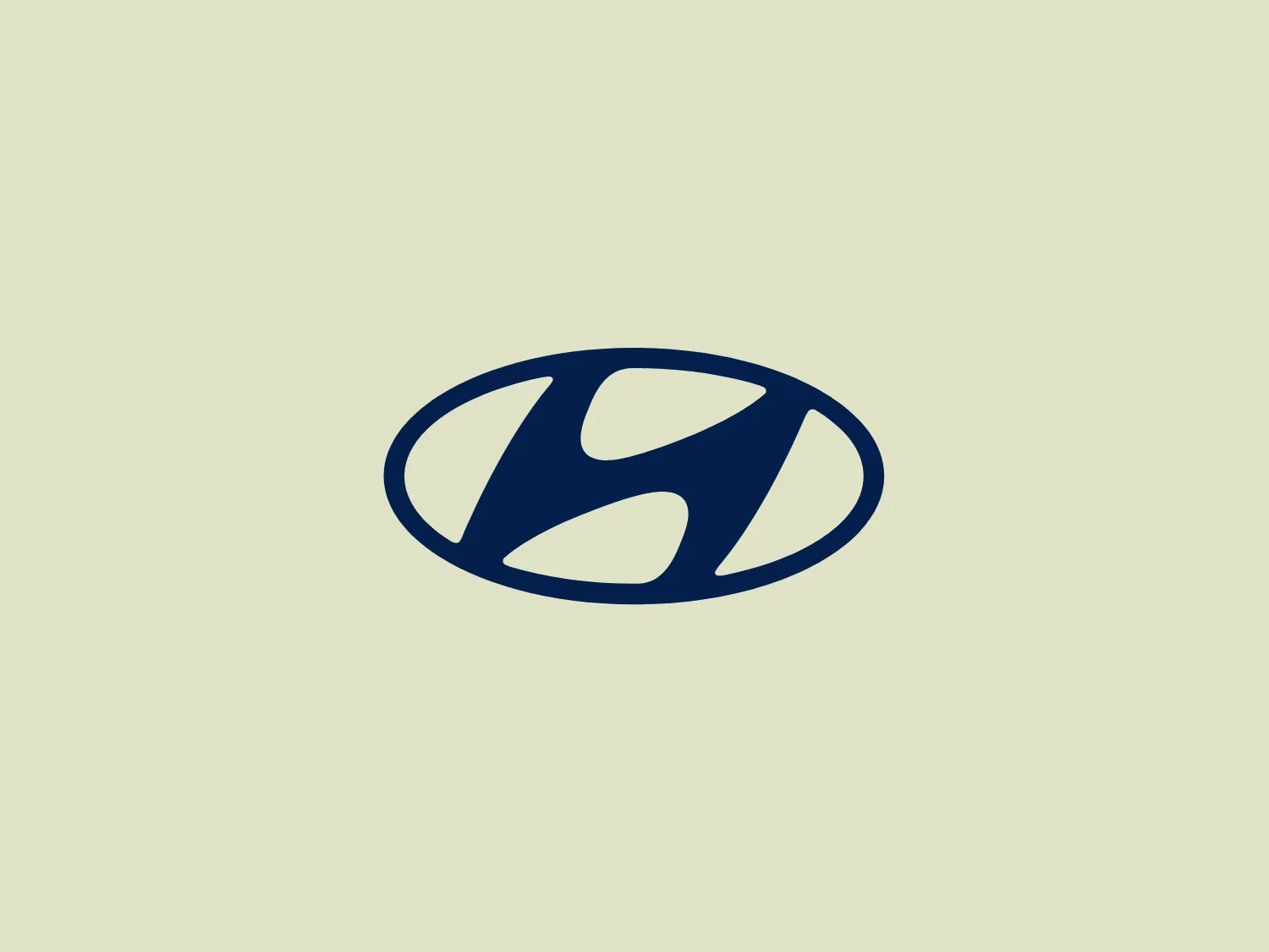 The Hyundai logo features a stylized oval shape in a deep blue color. Within the oval, there is an abstract design that resembles a dynamic letter 'H' or swirls cutting through the oval, with the negative space creating the impression of movement or speed. The shapes within the oval have rounded edges, contributing to a modern and streamlined aesthetic. This logo has a simple yet bold appearance, making it versatile for various applications. The blue color is vivid and professional, suggesting trust and reliability.