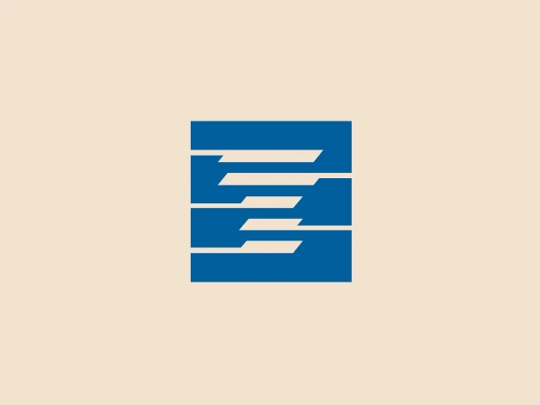 The bold, modern design of the stylized letter 'E' utilizing negative space and strong geometric shapes creates a distinct and versatile logo for TACT.