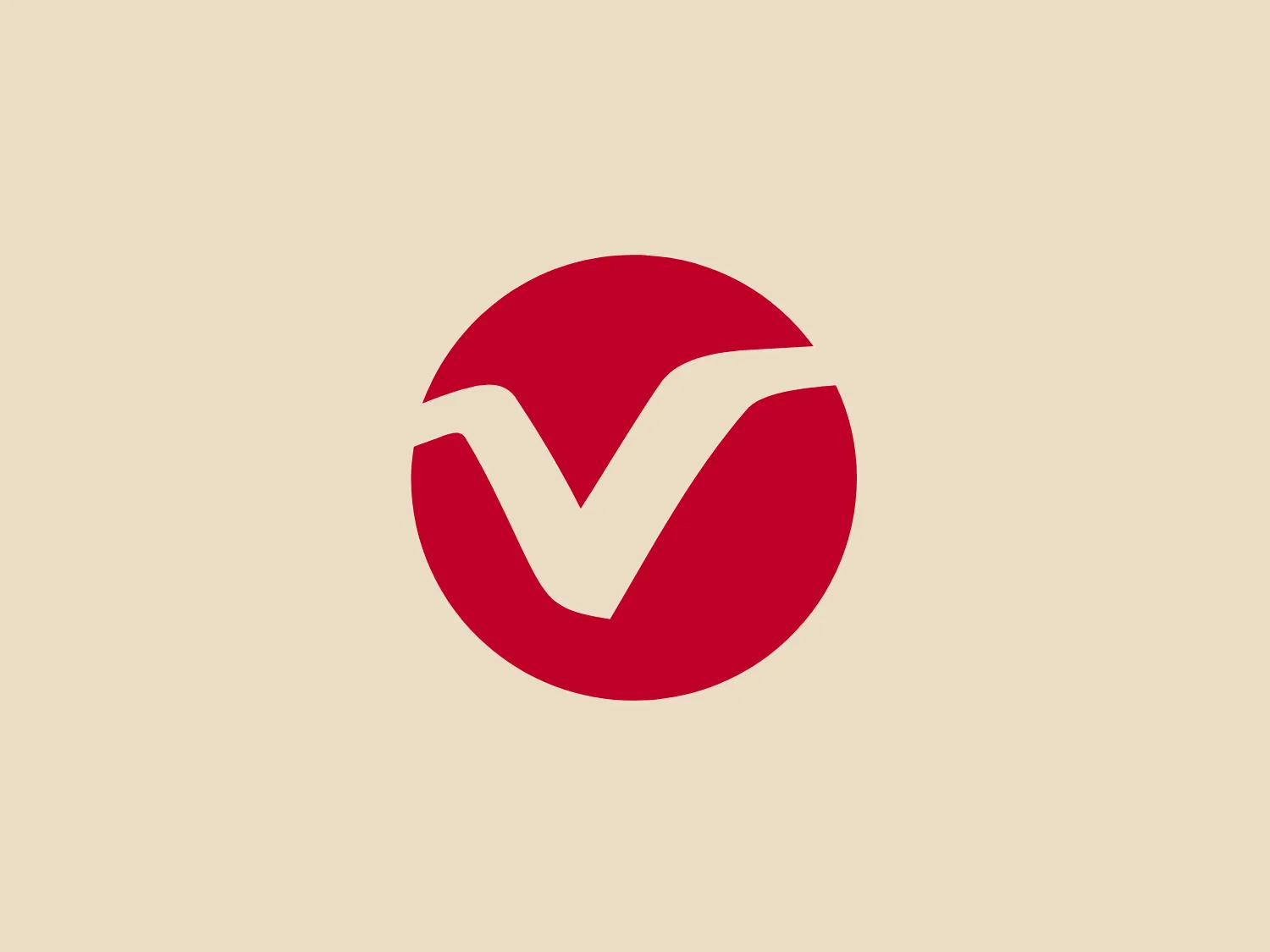The logo depicted is a simplistic and modern design consisting of a stylized red letter 'V' set within a circle. The 'V' has a unique cut that gives the appearance of a check mark, conveying a sense of correctness or approval. The red color is vivid and eye-catching, while the circular boundary adds a sense of completeness and unity to the design. The contrast between the red and the white space within the circle makes the Velcro logo pop and easily distinguishable.