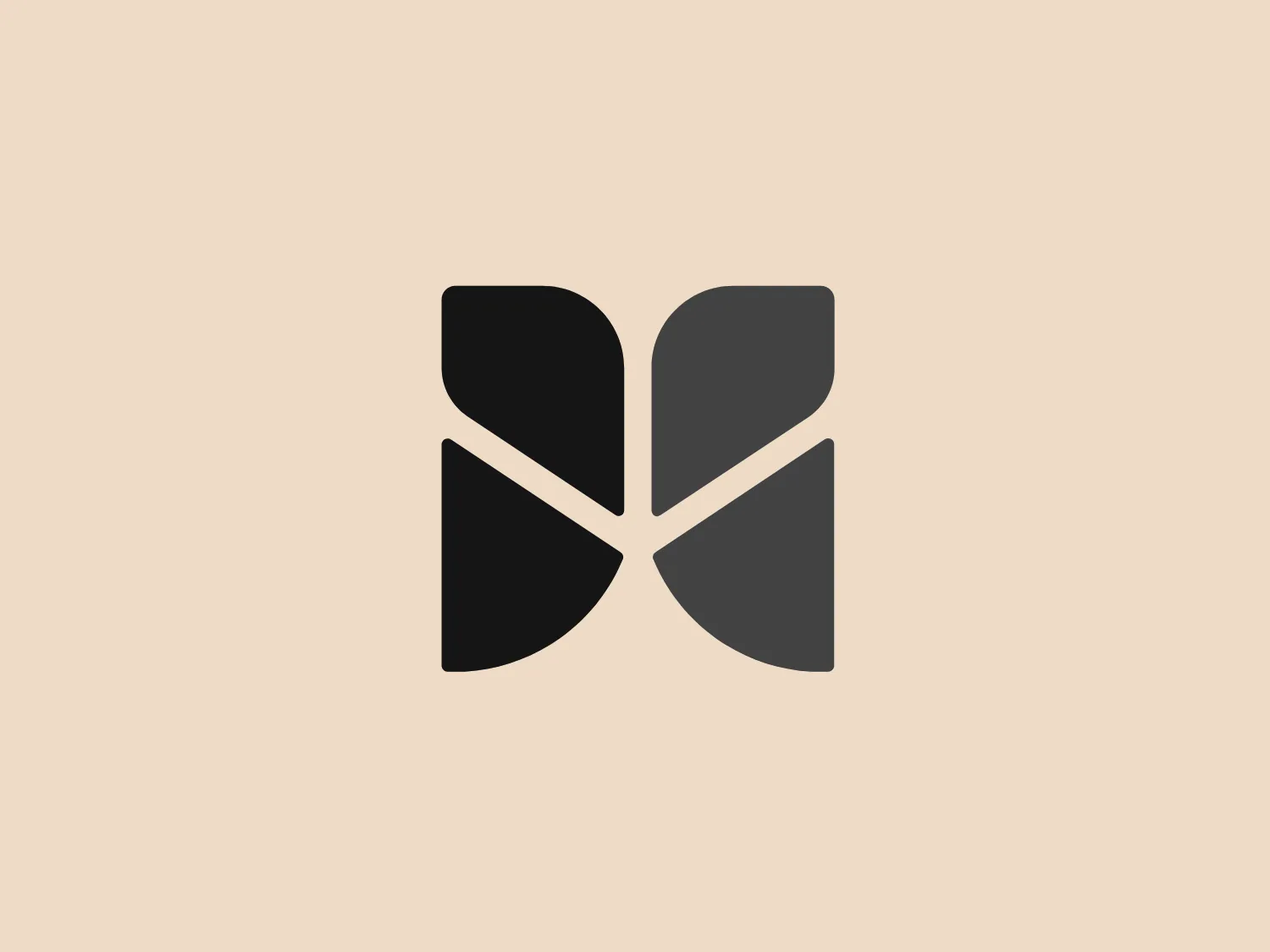 The John Muir Health logo appears to be a stylized letter constructed from geometric shapes, featuring a combination of a darker and lighter shade of purple. The design is symmetric along a vertical axis, with the left side mirrored on the right. The logo consists of four distinct sections, each resembling an abstract petal or leaf shape rounded at the top and converging to a sharp point at the center bottom. The overall aesthetic is modern and minimalistic with a clean, crisp feel exuding professionalism and sophistication.