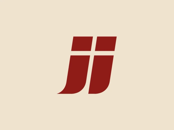 The Junckers logo features a bold and minimalistic design, showcasing a stylized representation of two identical shapes fused together in the center, reminiscent of the letter "J". The design exudes modern elegance with its straight lines, sharply angled bottom, and smooth curve at the top. The solid dark red color adds a sense of power and professionalism to the logo, making it stand out against a neutral background.