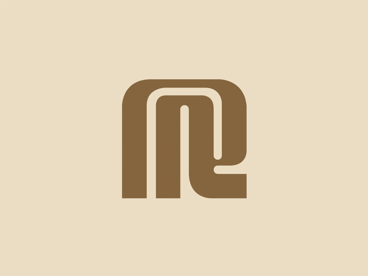 The logo for Regal Hotels presents a stylized lowercase letter 'n' with a modern, geometric design. It consists of bold, interconnected lines with rounded edges, creating a seamless flow throughout the symbol. The color of the logo is a muted shade of brown, which imparts a sleek, professional look. There's a notable balance and symmetry in the design, which is both simple and sophisticated. This logo could represent a variety of industries, from tech startups to lifestyle brands.
