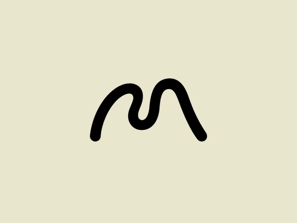 The Mellon Foundation logo features a minimalist design, with a stylized black line forming a smooth, wave-like shape with two peaks resembling the letter "M." The clean and modern design uses a bold, continuous line to create an iconic silhouette, exuding a sleek and straightforward brand image.