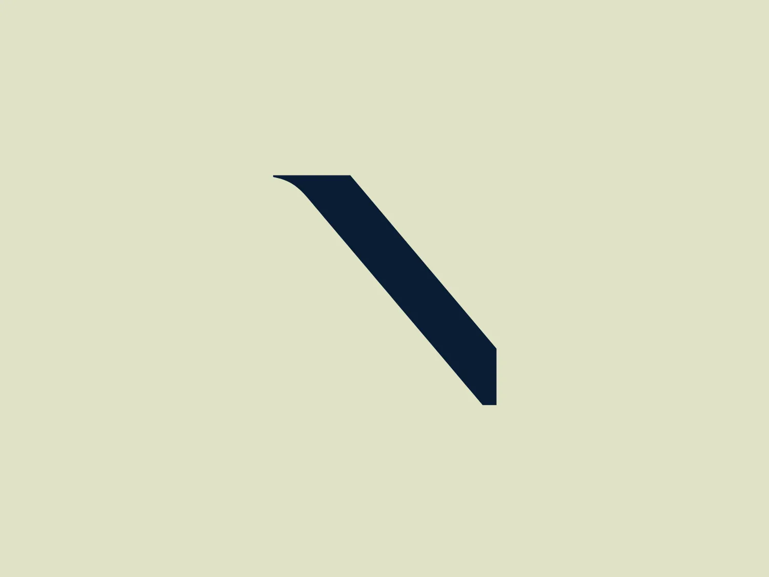 The National Gallery of Ireland logo features a single, dark blue, abstract shape that resembles an oblique angle or a stylized 'greater than' sign. Its design is crisp with clean lines, giving it a modern and minimalist aesthetic. The right edge of the shape is sharply pointed, adding dynamism and a sense of forward movement to the design. This simple and bold, angular logo is designed to stand out against a light and unobtrusive background.