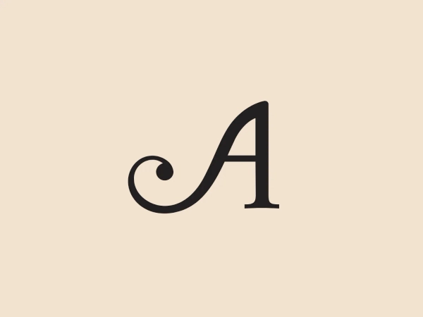The Antipodes logo showcases a stylized "A" with a classic and elegant design. The character combines a crisp, serif font for its primary vertical and horizontal lines with a whimsical, curling element at the beginning of the letter, adding a decorative flourish. Executed in a bold black color, the logo combines traditional elegance with a touch of creative flair, embodying a balance between formality and artistic expression. To complement this design, a neutral background that doesn't compete with the logo's elegance would be appropriate.