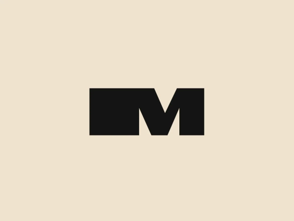 Something we like: The bold, geometric "M" design in solid black creates a modern and minimalist aesthetic, making the logo memorable and visually striking.