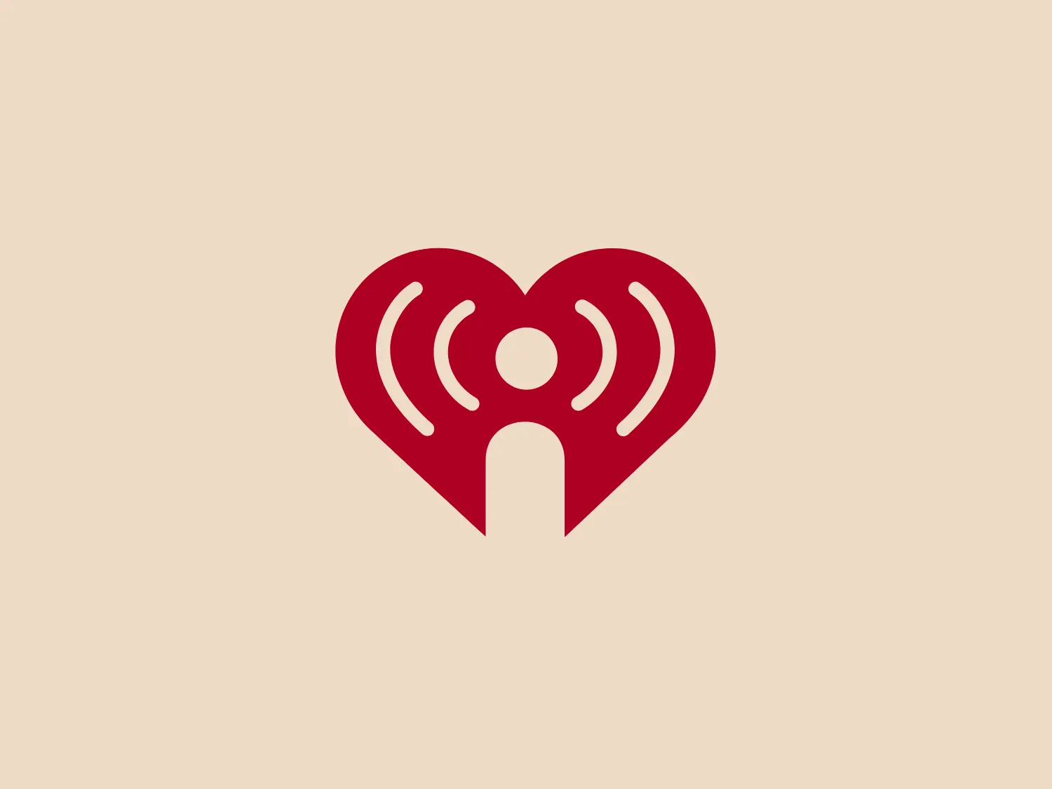 The iHeart logo showcases a stylized red heart, symbolizing love and connectivity. Within the heart, the negative space forms the silhouette of a humanoid figure with raised arms, subtly accented by two concentric arcs resembling Wi-Fi signal bars, conveying communication and networking. The design is sleek and contemporary, devoid of sharp angles, with a vibrant, bold red color for immediate visibility. The aesthetic is inviting yet powerful, hinting at a fusion of technology and human emotion.