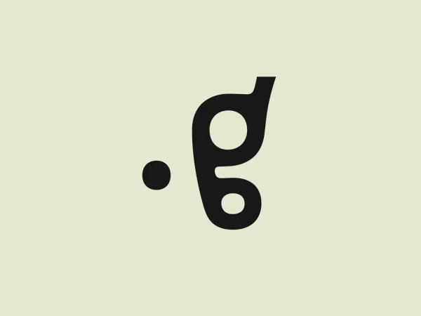 The Good Design Journal logo consists of a stylized, abstract design that may suggest a lowercase "g" with a dynamic and fluid appearance. The main element features a bold red color with smooth curves and circular forms, giving the logo an energetic and modern feel. Its simplicity and elegance suggest versatility and potential for various applications. The use of negative space within the shape adds a level of sophistication to the design.