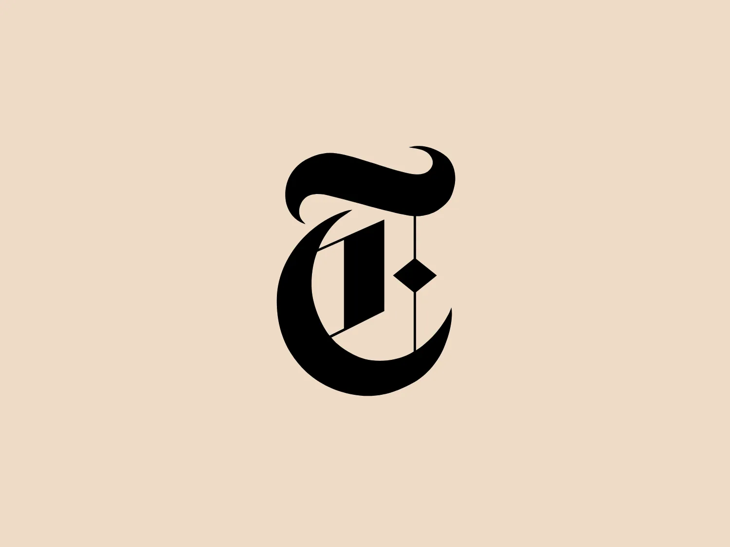 The New York Times logo shows a stylized letter composed of bold black shapes with sharp and flowing contours, creating an abstract, modern appearance. The design suggests motion and transformation, utilizing negative space to form part of the letter's structure and an additional geometric shape within it. The contrast between the solid black areas and the white background adds to the logo's visual impact.