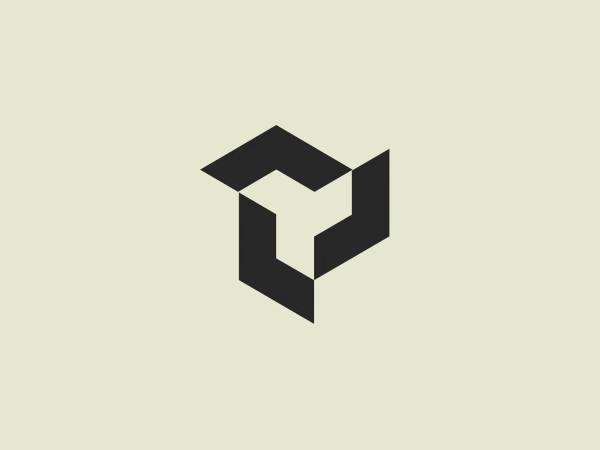 The Yatirim Finansman logo depicts a stylized, abstract design that looks like a combination of geometric shapes creating an optical illusion. The shape recalls a three-dimensional cube or box, with elements appearing to interlock. The logo uses two tones of a dark blue palette that give it depth and contrast. The design is modern, clean, and appears dynamic due to its contrasting planes that suggest movement or rotation. It would stand out crisply against a light background that doesn't compete with its color intensity.
