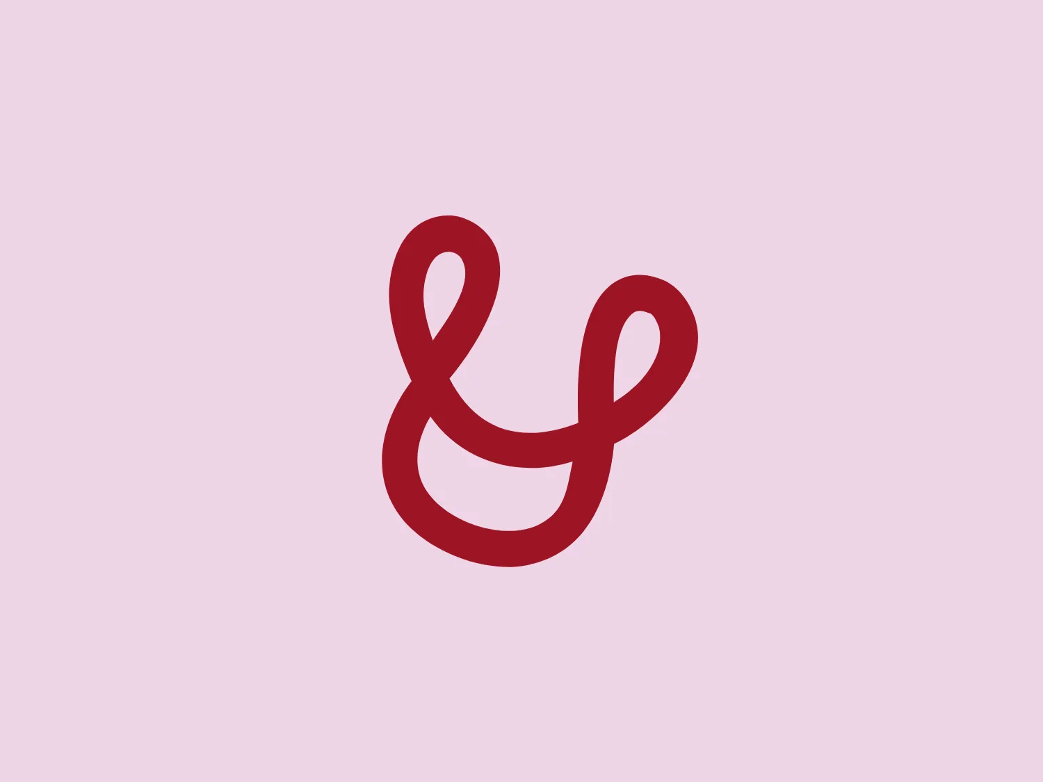 The Urdang Academy logo presents a minimalist, modern interpretation of an ampersand symbol. It features a continuous, flowing line creating an abstract representation of the '&' character. The smooth, rounded shape with vibrant red color conveys fluidity and elegance. The simple yet distinctive design is associated with creativity, unity, or connectivity in a contemporary context.