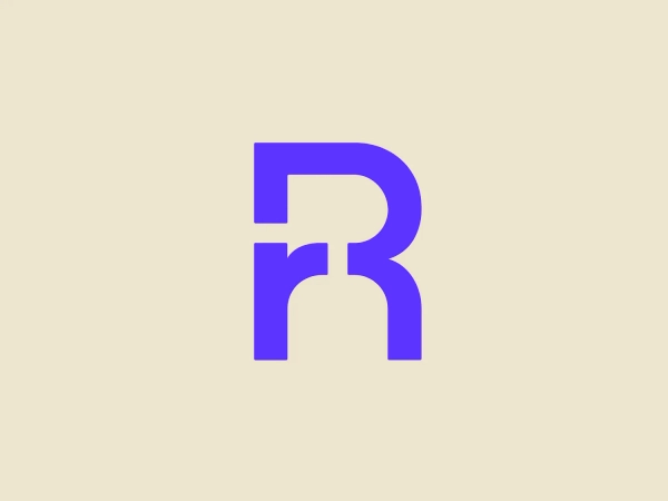 The Resonator logo is a stylized letter 'R' crafted with bold, geometric shapes and a modern, minimalist aesthetic. It features a vibrant purple color, evoking creativity and uniqueness. The 'R' is constructed with seamless straight and curved lines, creating a sense of continuity and flow. The top part extends outward with a slight curve, while the leg is formed by a downward stroke that curls inward at the bottom, giving the logo a distinct and memorable look.