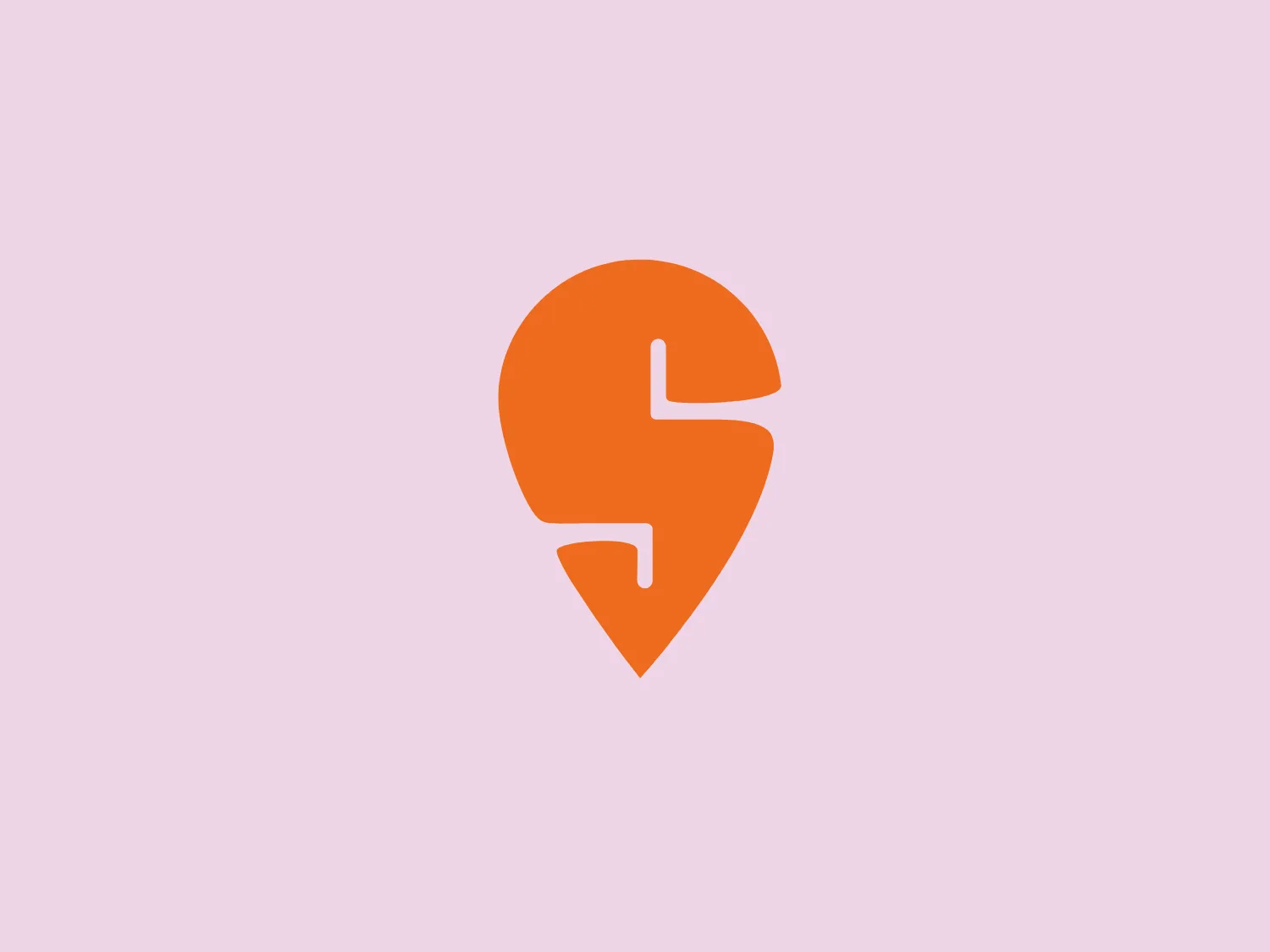 The Swiggy logo features an abstract, stylized mark that combines elements of a location pin and an electric spark or stylized letter S. It is depicted in a vibrant, solid orange color, exuding a fresh and energetic feel. The design's effective use of negative space within the pin-shape gives it a modern, minimalist look, suitable for digital platforms and implying a technology or location-based service.