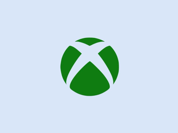 The Xbox logo features a bold, abstract design reminiscent of a spherical shape made with four distinct green segments. These segments interlock in the center, forming an 'X' that stands out against the white negative space. The overall aesthetic is modern and dynamic, with a sense of movement implied by the way the segments overlap and intertwine. Its symmetry and the use of a single, solid color give it a strong and recognizable identity.