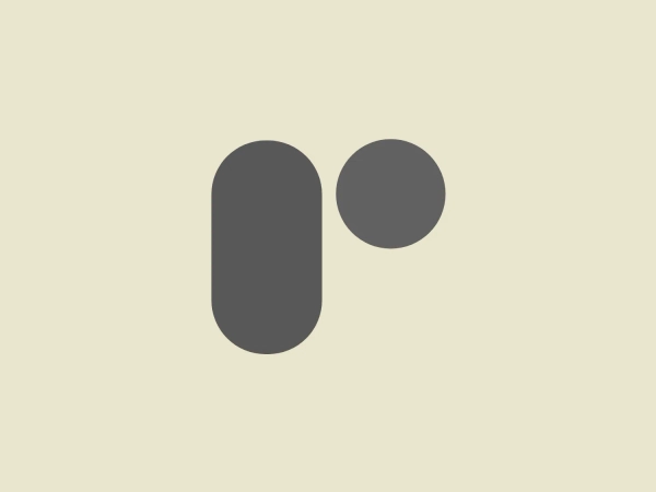 The Revelater logo is a simplistic and modern design comprised of two geometric shapes—a glossy lavender rounded rectangle paired with a vibrant mint green circle. These two shapes, while separate, are positioned closely together, suggesting connection or interaction. The rounded edges and simple forms lend the logo a friendly and approachable feel, while the distinct colors help it stand out and suggest creativity or innovation. The fresh color palette of the logo would be complemented well by a soft and neutral background.