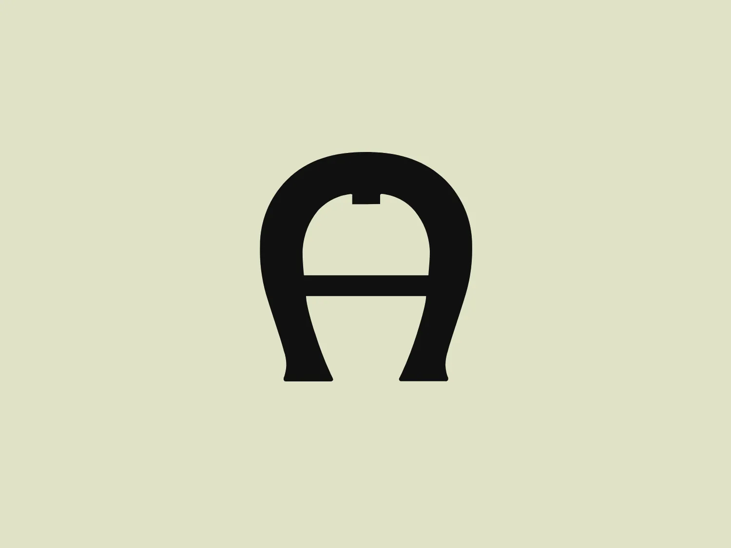 The Aigner logo is a stylized, abstract design primarily composed of bold, black elements forming a shape that resembles a letter from the Latin alphabet. It consists of two vertical, symmetrical strokes connected by a horizontal bar near the top, with a distinctive gap in the center of the connecting bar. Below the bar, there is an additional horizontal line that appears to bisect the lower half of the design, giving it a balanced and stable appearance. The rounded ends of the vertical elements soften the overall effect, adding a touch of elegance to the otherwise solid and geometric figure. The design is simple, modern, and could be associated with a variety of industries.