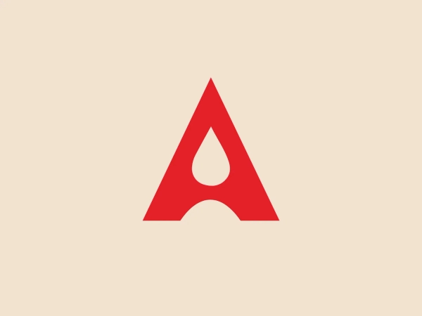 The image for Africa Oil depicts a stylized letter "A" in a striking bright red color, with a bold and modern design. The "A" incorporates a distinctive feature resembling a drop or a flame within its structure, adding a dynamic and fluid element to the otherwise geometrically solid figure. The character is sans-serif with a clean cut, lacking any additional embellishment, giving it a contemporary and professional appearance. The rounded base of the "A" contributes to the overall friendly and approachable feel of the logo.
