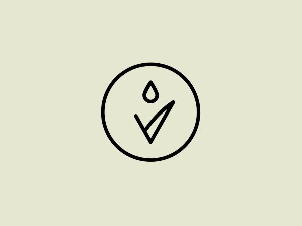 The Loverte logo showcases a stark, minimalist design. It includes a black outline of a circle holding a stylized, simplistic image combining a droplet and a tick mark. The design emphasizes clean lines and modern aesthetics, utilizing geometric shapes and negative space. The droplet conveys fluidity and freshness, while the check mark signifies positivity and approval. The monochromatic color scheme enhances the logo's sleek and contemporary appeal.
