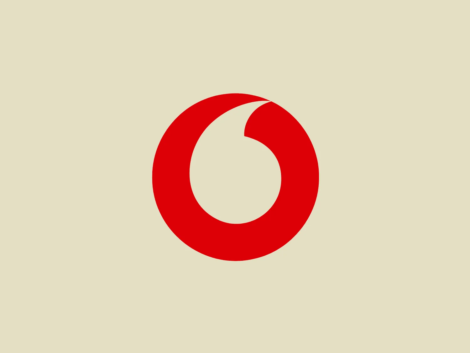 The Vodafone logo is a bold, circular design consisting of a crimson red color. It features a swirl starting from the edge and curving into the center, creating a dynamic sense of movement. The design is simple yet impactful, with a modern vibe and an easily recognizable shape. The clean lines and lack of additional embellishments contribute to its sleek and contemporary aesthetic.