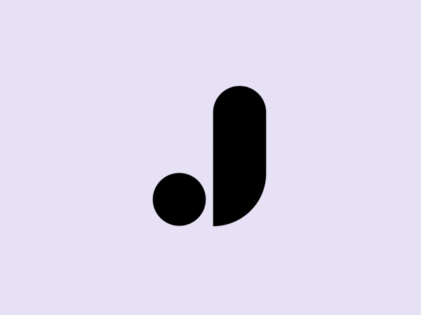 The James UK logo is a sleek and contemporary design, featuring two black shapes on a white background. The shapes create a minimalist representation of a lowercase 'b', with a full circle representing the dot and a vertically elongated teardrop shape forming the body. The design exudes a modern and clean aesthetic with its solid fill, sans serif styling, and smooth curves, while the sharp contrast between the black shapes and the white space adds to its overall impact.