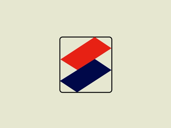 The Seiko Family logo features a minimalist geometric design consisting of two overlapping diamond shapes, one red and one blue, against a white background, enclosed within a thin black square border. The diamonds are rotated 45 degrees to appear as squares set on one of their corners, creating an intriguing interplay of form and negative space. The red diamond is on top and off-centered to the right, giving a dynamic and modern feel, while the blue diamond beneath it is slightly larger and shifted to the left, offering balance and depth to the design. This simple yet bold logo conveys stability and professionalism with its clean lines and limited color palette.