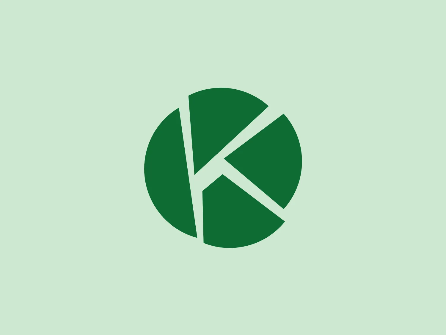 The Kids Design Award logo features a circular design with segments resembling a pie chart or camera shutter. The sleek and modern design includes three shades of green, creating a gradient effect. Abstract arrowhead shapes suggest movement or progress, with a clean and professional aesthetic.