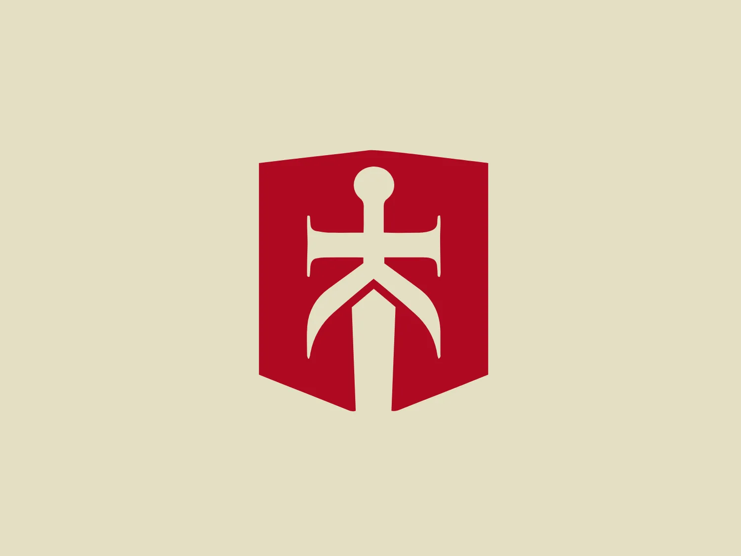 The Burny Kaliburn logo features a bold, solid red shield as its backdrop, with a white stylized emblem at its center that resembles an abstract figure or perhaps an anchor, with arms extending upward and outward and a split bottom section that spreads into a broad, stable base. The design has a strong and protective connotation, with its shield shape suggesting defense or safety, and the emblem inside conveying strength and stability. The colors are high-contrast, which allows for the icon to stand out with clarity and direct visual impact.