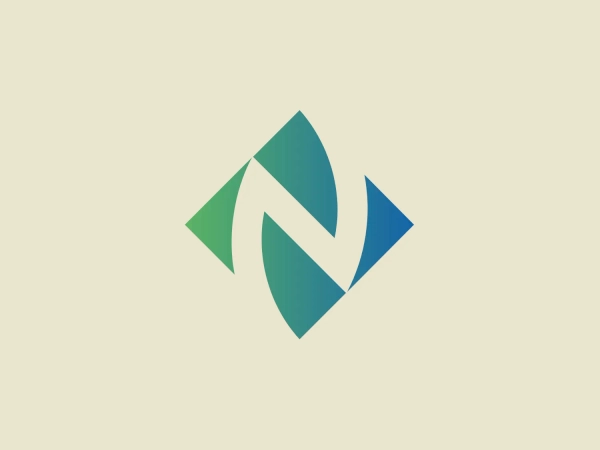 The NW Natural logo features an abstract design with a modern and dynamic aesthetic. It is composed of three overlapping and interlocked shapes resembling pointed ovals or elongated leaves, each with a unique color. The colors graduate from a dark teal on the left through a medium shade of green, to a rich blue on the right side, creating a sense of movement and flow. The shapes are arranged to form what could be interpreted as a stylized letter 'N', suggesting the logo might be associated with a brand or company with an initial 'N'. The logo's design is clean, with no additional embellishments, which gives it a professional and polished look.