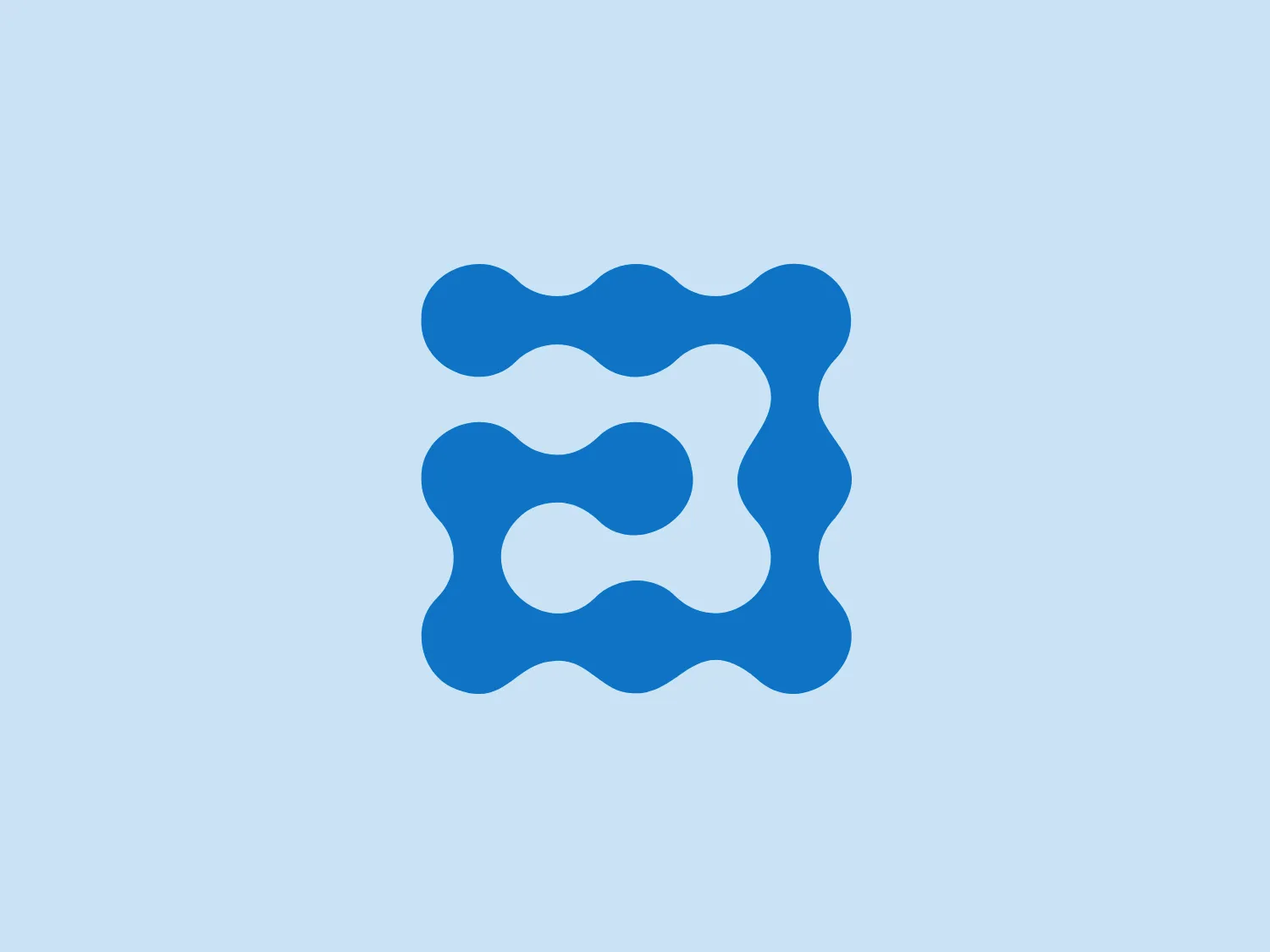 The HR Answerbox logo features an abstract, organic shape with a sequence of flowing curves forming a square-like perimeter with rounded edges. The design resembles a looping figure-eight or infinite path and is colored in a vibrant and solid blue. The overall aesthetic is modern, minimalist, and dynamic, suggesting fluidity and continuous movement.