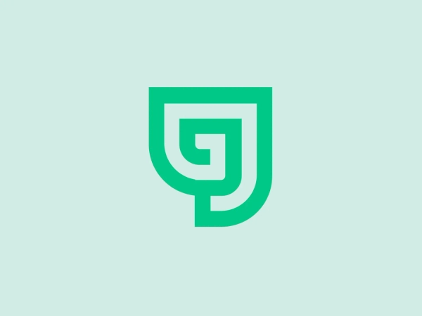 The Gravity Jack logo features a stylized shield composed of geometric shapes forming a layered, maze-like pattern. The bright, monochromatic green palette gives it a modern and vibrant feel, with negative space cleverly forming an abstract letter 'G'. The design exudes a tech-savvy, secure, and strong brand aesthetic, likely indicating protection or stability as part of its branding message.