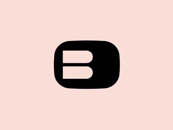 The Buckle logo is a modern and striking representation of the letter "B." It is composed of a bold, black rectangle with rounded corners, creating the main body of the letter, and a smaller, similarly shaped rectangular cutout that defines the letter’s vertical spine. The design emphasizes geometric shapes and minimalism, and its stark contrast would enhance its boldness and visibility on a lighter background.