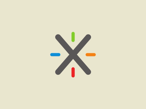 The image depicts a stylized logo consisting of an X-like figure where the ends of each arm extend beyond the intersection, forming a sort of pinwheel shape. Each arm of the X is colored differently with simple, bold colors: green, blue, orange, and red, moving in a clockwise direction from the top arm. The XWiki itself is colored in a medium gray tone, contrasting with the vivid colors at its tips. The design is minimalistic and modern, with a playful touch provided by the contrasting colors. The straightforward geometry of the design gives it a clean and balanced aesthetic.