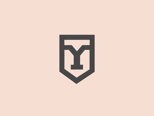 The York College logo showcases a stylized shield shape with a bold, modern aesthetic. The prominent letter "Y" within the shield features distinctive design elements, such as flat edges on the arms and a seamless merge with the shield's lower boundary. The vibrant green color conveys a sense of growth, renewal, or environmental focus. The logo effectively utilizes negative space, with the shield's background shaping the letter "Y." Its crisp lines and geometric symmetry symbolize a balance of tradition and innovation.