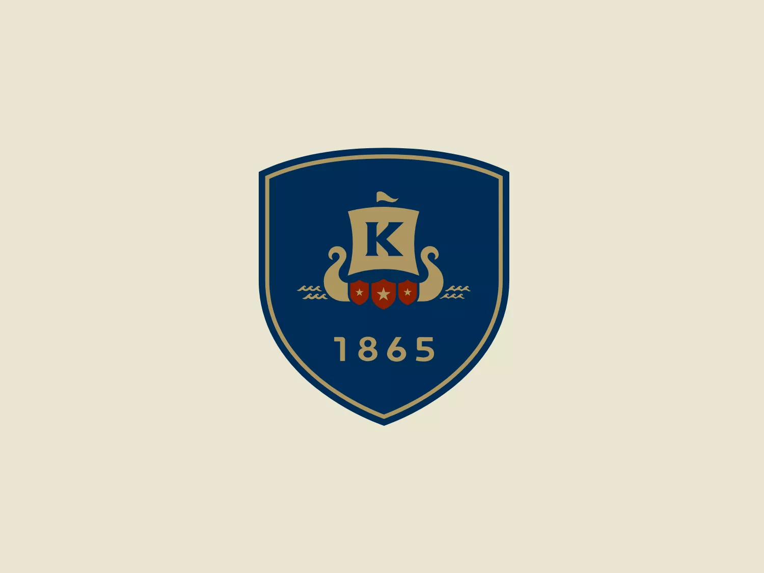The King School logo showcases a dark blue shield with a golden border, exuding a classic and regal aura. A stylized golden kettle with a bold letter "K" at the center represents a possible initial or emblematic symbol of the school. Below the kettle, three five-pointed stars line up horizontally, accompanied by two wavy lines suggesting steam or heat. The prominent display of the year "1865" at the bottom signifies an important founding date or historical reference. The elegant contrast between the golden elements and dark blue background, along with the traditional serif font used for the date, adds to the logo's timeless appeal.