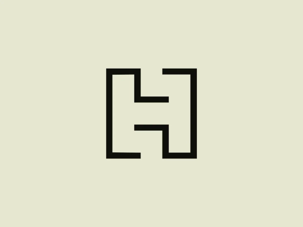 The image depicts a bold, minimalist logo consisting of a stylized letter "H" made from thick black lines. The letter features right angles and straight lines, creating a geometric and symmetrical design. The aesthetic is modern and strong, with a sense of stability and balance conveyed by the equal weight of the lines and consistent negative space within the letter's form. The simplicity of the Hachette Livre logo ensures versatility and easy recognition.