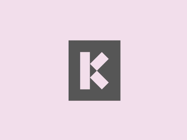 Here's what we like: The striking and modern "Kemitt" logo - a bold, minimalist design with a vibrant orange square and uniquely styled white letter "K."