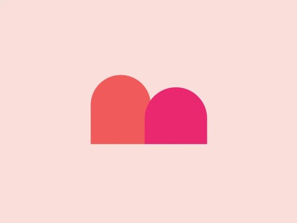 The Mycall logo features two overlapping geometric shapes resembling rounded hills or semi-circles. The one on the left is colored in a rich coral red, while the right shape is a bold magenta, creating a sense of vibrancy and energy. The portion where the shapes overlap appears in a blended hue due to the transparency effect, giving the design a modern, layered look. The silhouette's simplicity and the absence of text or additional elements contribute to a minimalist and contemporary aesthetic that could be versatile for various branding applications.