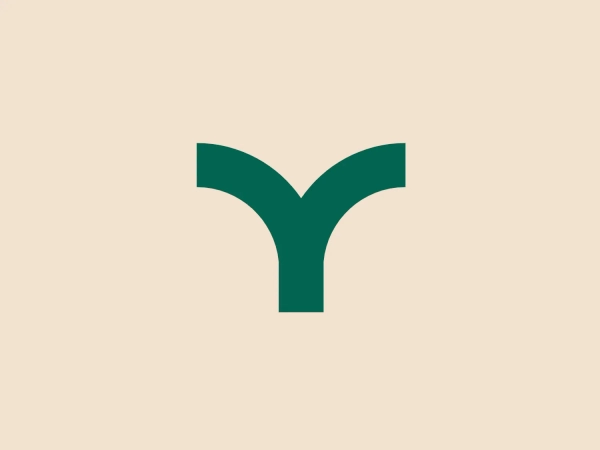 The Loyal logo depicts a stylized, dark green "Y" with a soft curvature extending into broad arms from a narrow base, giving it a dynamic and organic appearance. The arms of the "Y" thicken as they curve outward, suggesting growth or expansion. The color of the logo is a deep and professional shade of green, which often represents growth, renewal, and vitality. The overall design is minimalistic and modern, with no additional embellishments, making it versatile and easily recognizable. Considering the color and design of the Loyal logo, a contrasting light background that complements the green without overwhelming it would be most suitable.