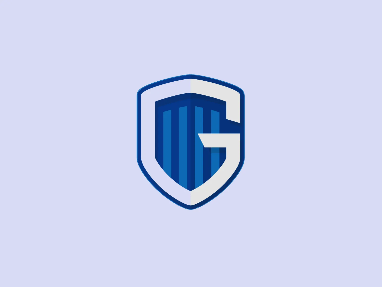 The KRC Genk logo features a stylized shield shape, predominantly in shades of blue. It includes a bold white "G" with a modern sans-serif typeface that conveys strength and stability, set against a blue striped background. The shield border is outlined in a lighter shade of blue, adding contrast and highlighting the contour of the shield.