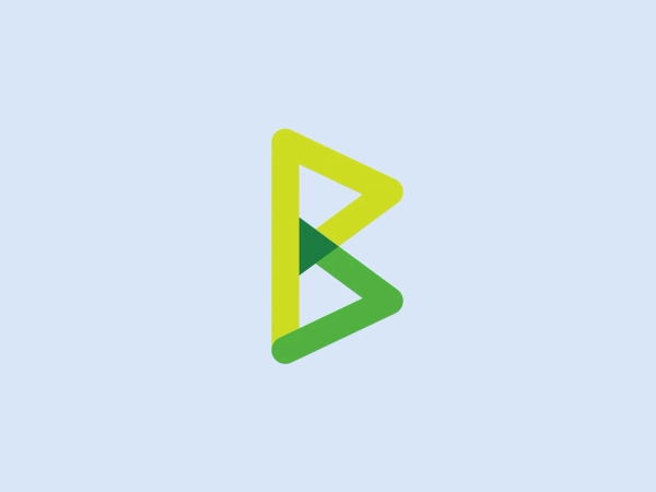 The image depicts a modern, minimalistic logo composed of abstract geometric shapes that form the stylized letter "B," representing BTCPay. The primary triangle is colored in a gradient of vibrant yellows and greens, ranging from a bright lemon yellow at the top to a grassy green at the bottom, giving the logo an energetic and fresh appearance. The negative space formed creates a smaller, inverted triangle that reinforces the perception of depth and dimension, giving the logo a sense of dynamic motion and innovation, suitable for a contemporary and forward-thinking brand identity.